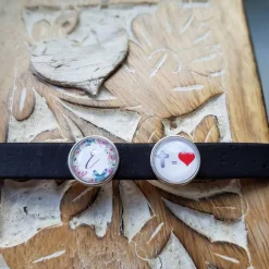 Outlet Armband aus 10mm breiten schwarzen Kork mit Buchstaben Schmetterling und Kreuz gleich Liebe Slidern. Schmuck