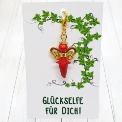 Discount Glücksbringer Schmetterlingselfe goldfarben/rot – Zauberhafter Anhänger mit Schmuckkärtchen Geschenke
