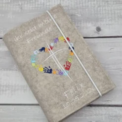 Discount Gotteslobhülle Ihr seid meine Freunde, Kreuz mit Herz aus Händen; beige Gotteslobhülle