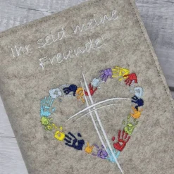 Discount Gotteslobhülle Ihr seid meine Freunde, Kreuz mit Herz aus Händen; beige Gotteslobhülle