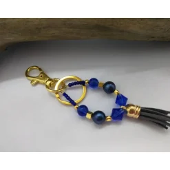Accessoires|derWolltiger Designs Schlüssel-/Taschenanhänger Tropfenform, Blau-Gold, personalisierbar